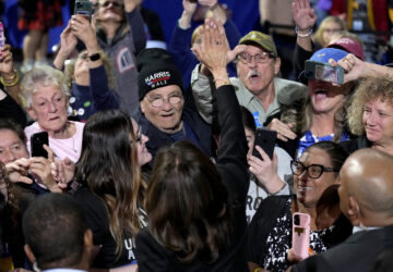 Democratic presidential nominee Vice President Kamala Harris, bottom center, gives a high-five as she greets supporters at a campaign rally at Erie Insurance Arena, in Erie, Pa., Monday, Oct. 14, 2024. (AP Photo/Jacquelyn Martin)